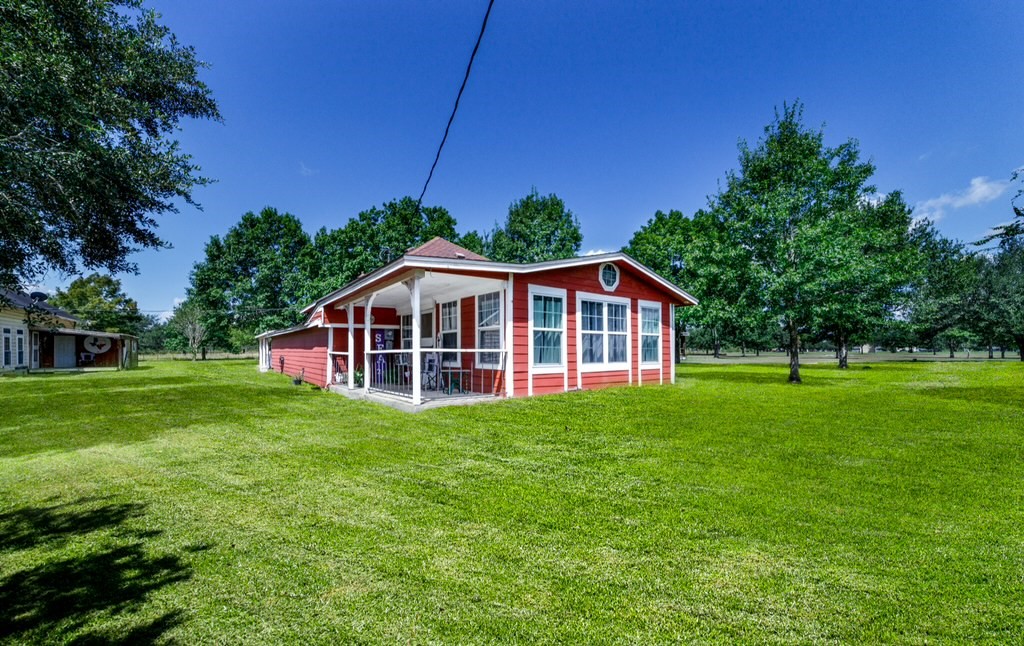 13025 Battle Road Beasley, TX 77417 - Photo 2 of 11 a view of a house with a big yard