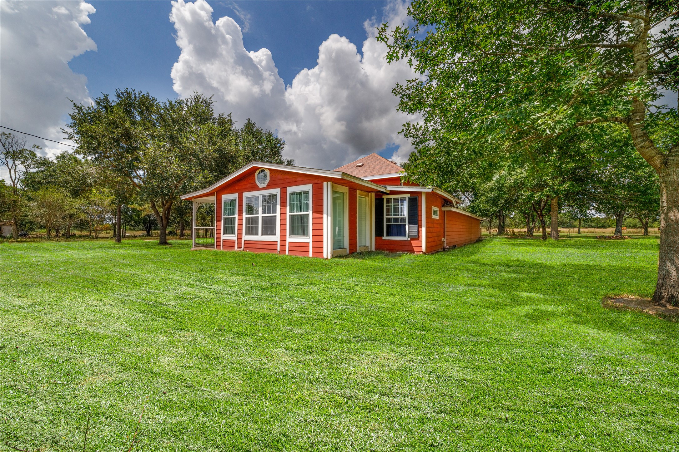 13025 Battle Road Beasley, TX 77417 - Photo 4 of 11 a view of a house with a backyard