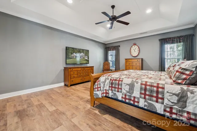 a bedroom with a large bed and a window