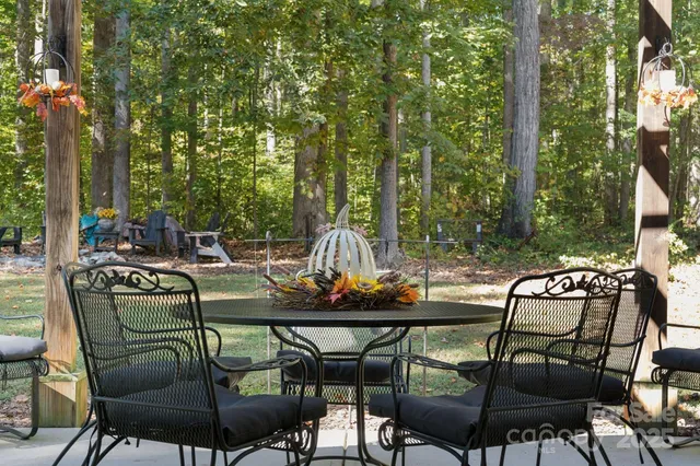 a view of a patio with couple of chairs