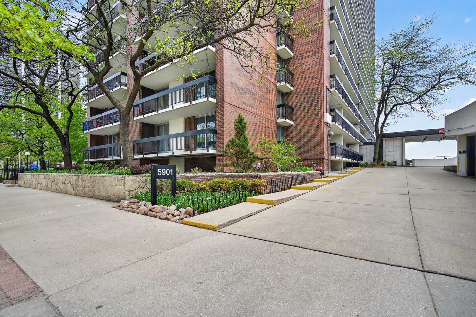 5901 North Sheridan Road, Unit 7G Chicago, IL 60660 - Photo 20 of 21 a street view along with residential houses