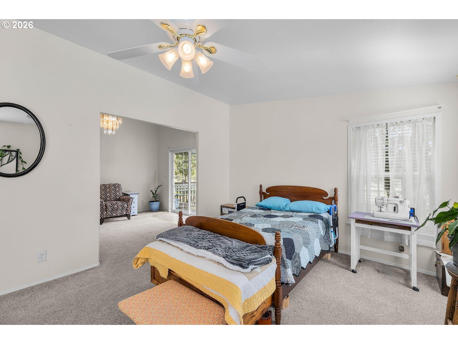 6983 Mustang Road Terrebonne, OR 97760 - Photo 14 of 36 a bedroom with a bed a chandelier and a mirror