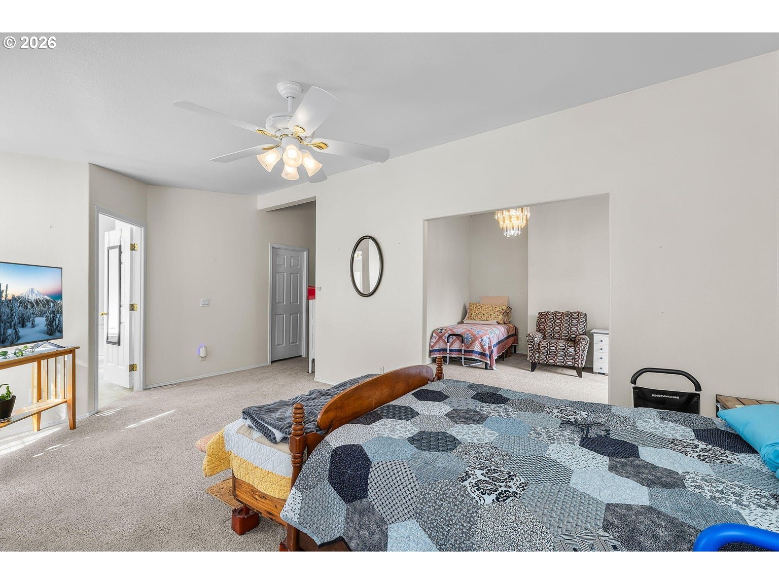 6983 Mustang Road Terrebonne, OR 97760 - Photo 15 of 36 a bedroom with bed and a chandelier