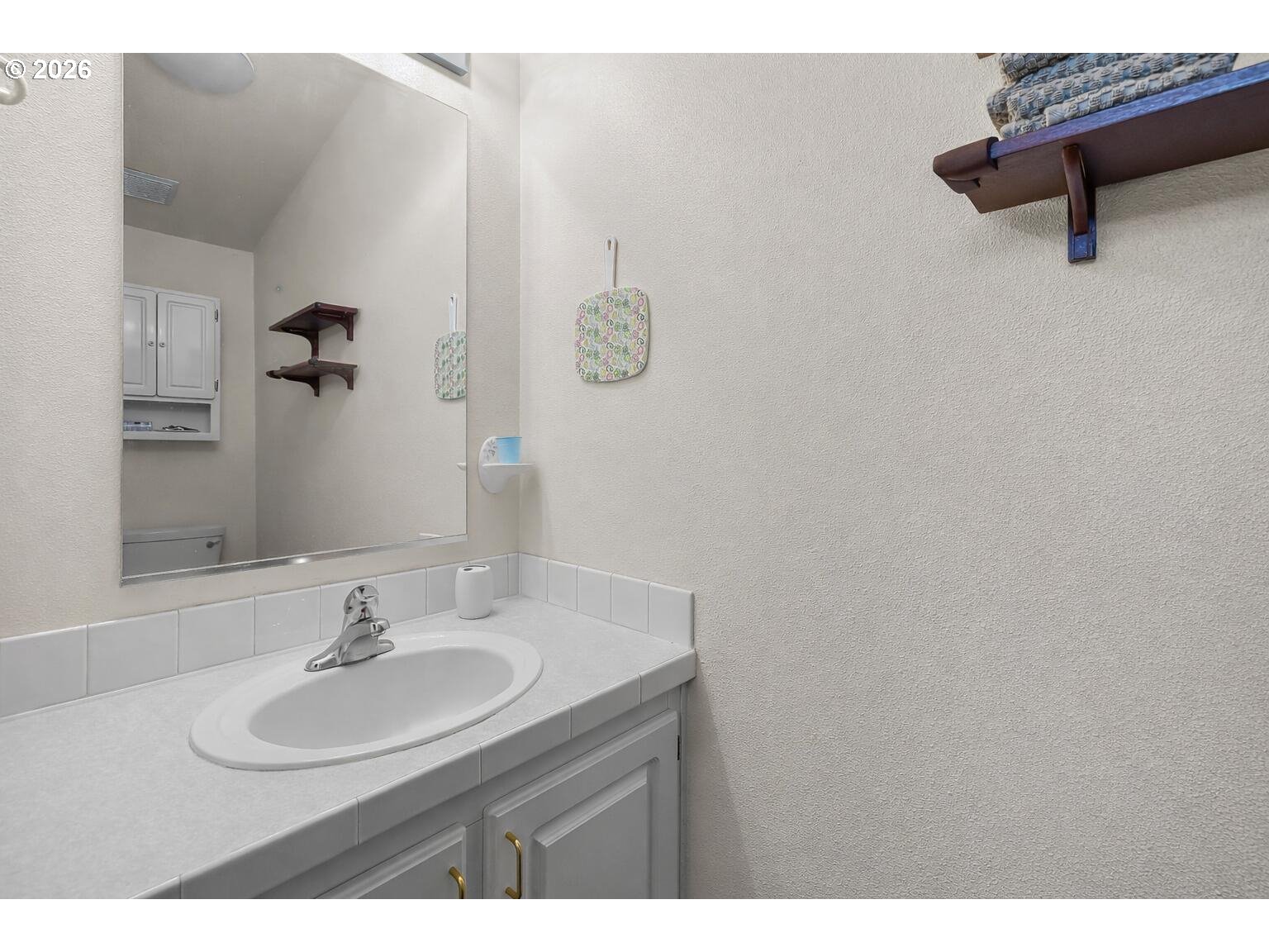 6983 Mustang Road Terrebonne, OR 97760 - Photo 21 of 36 a bathroom with a sink and a mirror