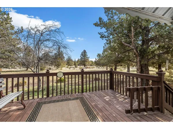a view of balcony with wooden floor