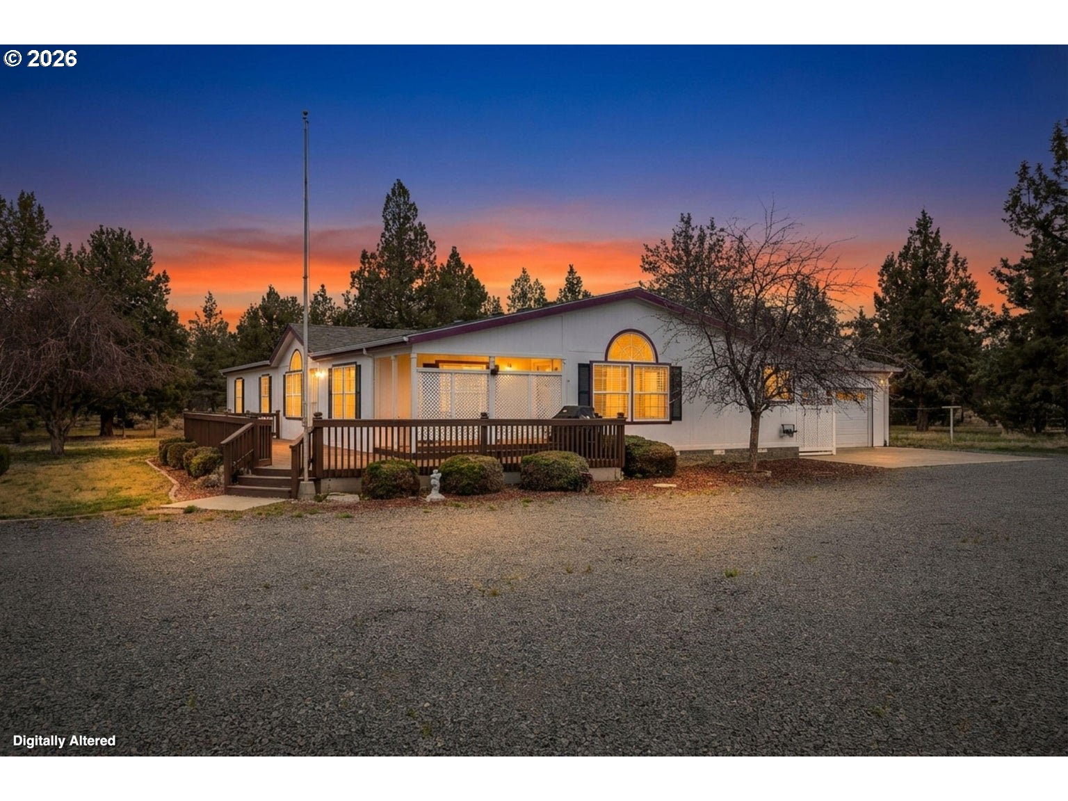 6983 Mustang Road Terrebonne, OR 97760 - Photo 3 of 36 a view of a house with backyard space and a pond