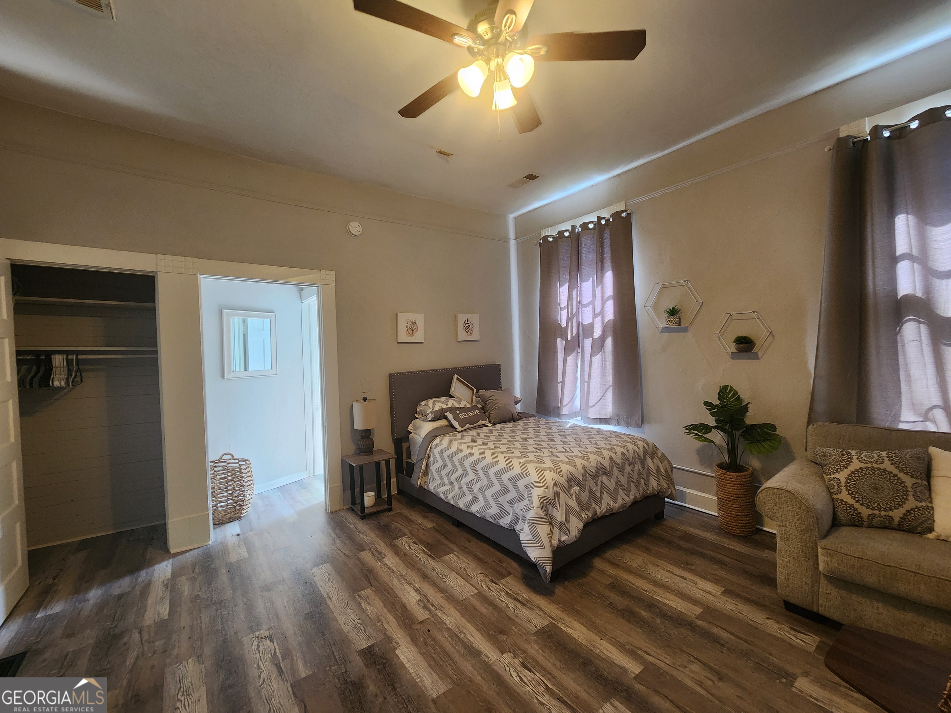 917 Oakview Avenue, Unit 5 Columbus, GA 31906 - Photo 10 of 15 a bedroom with a bed and ceiling fan
