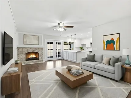 a view of kitchen with stove refrigerator and cabinets