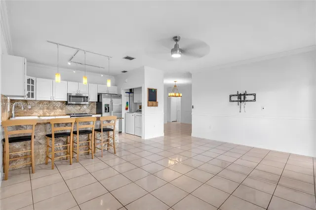 a view of a kitchen and dining area
