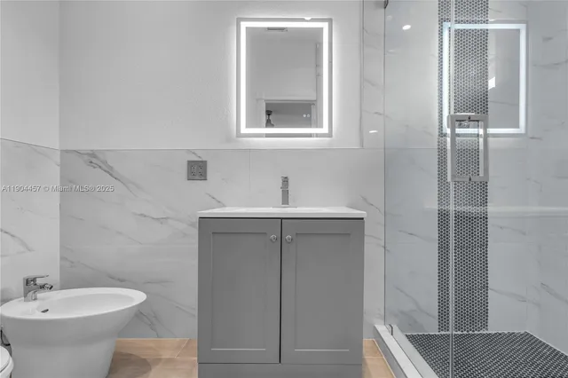 a bathroom with a sink toilet and shower