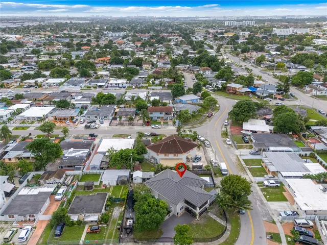 an aerial view of residential houses with outdoor space