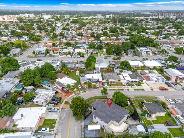 an aerial view of residential houses with outdoor space
