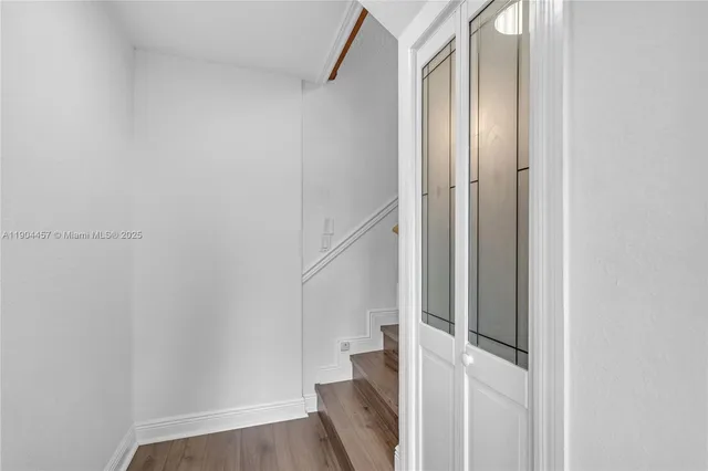 a view of entryway with wooden floor