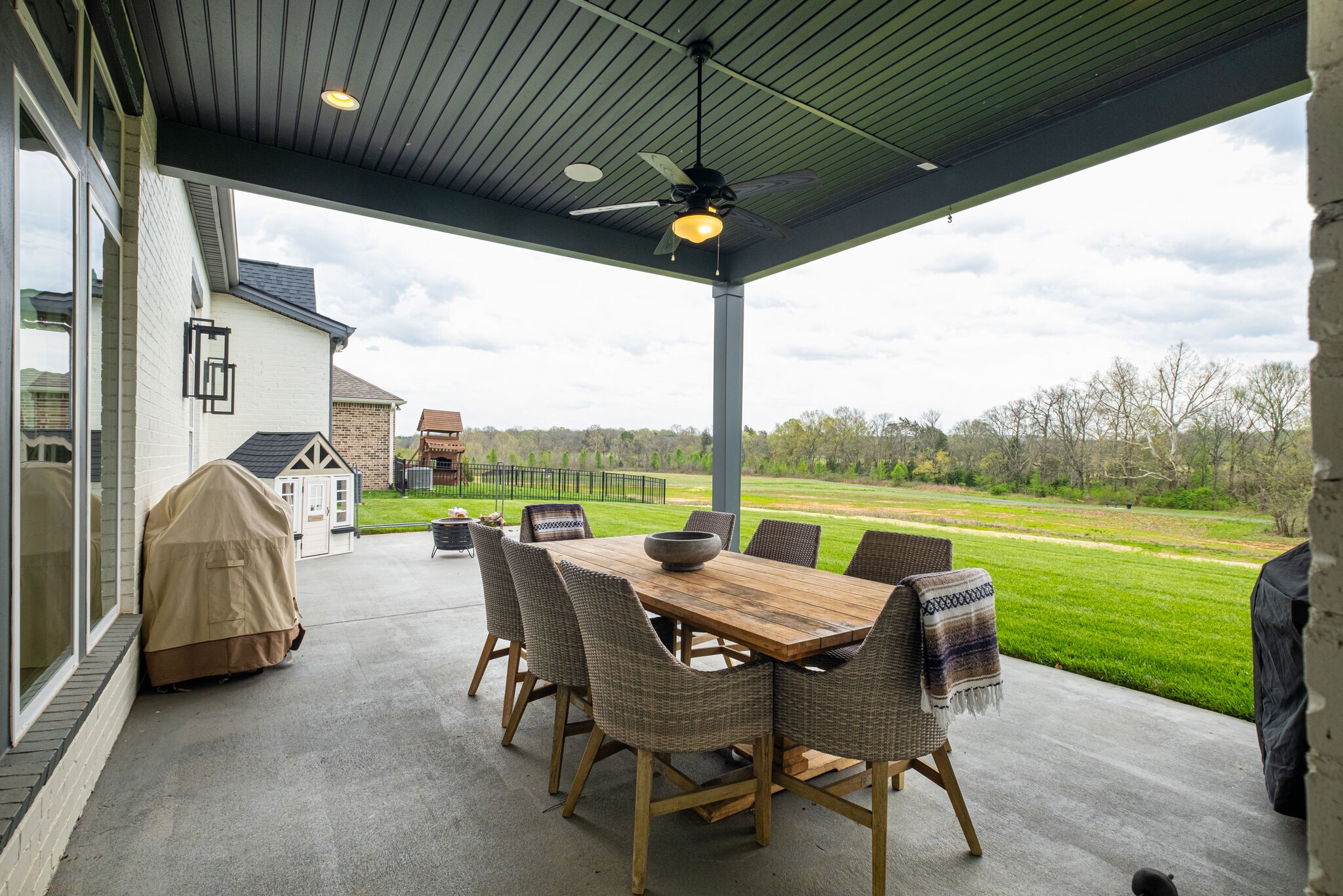 3010 Ranch Rd Mount Mount Juliet, TN 37122 - Photo 45 of 51 a view of a patio with table and chairs a barbeque grill with a big yard