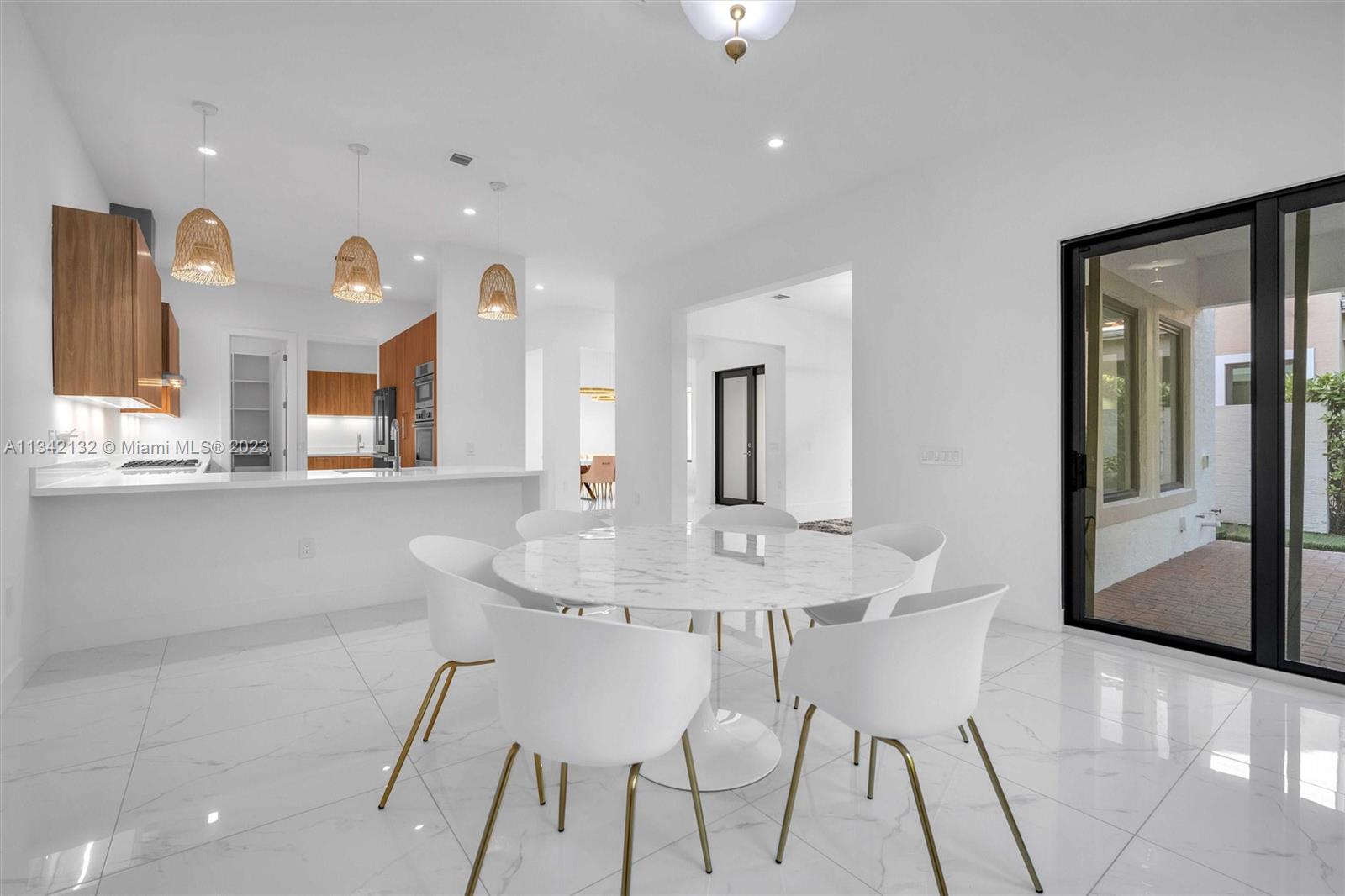 5840 Brookfield Circle Hollywood, FL 33312 - Photo 13 of 45 a view of a dining room with furniture and a chandelier