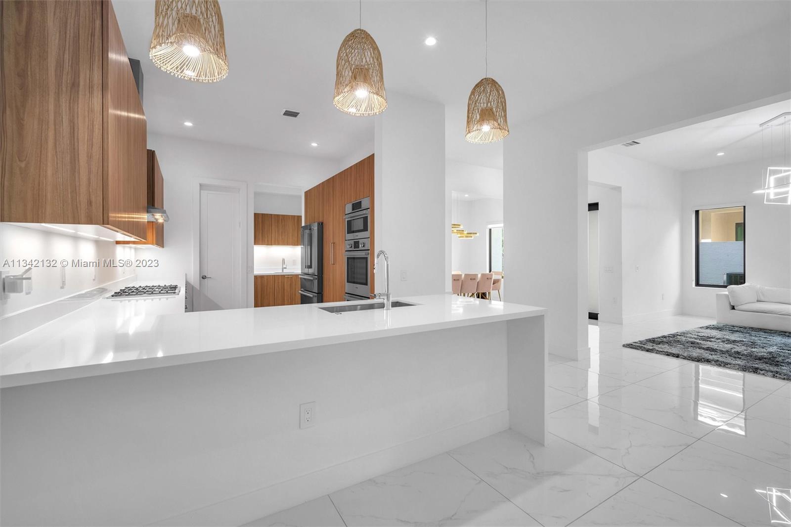 5840 Brookfield Circle Hollywood, FL 33312 - Photo 14 of 45 a kitchen with counter top space and living room