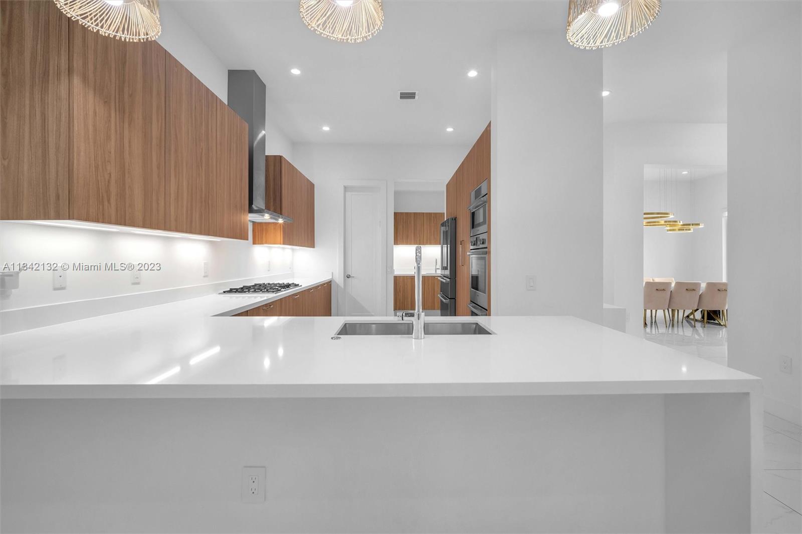 5840 Brookfield Circle Hollywood, FL 33312 - Photo 15 of 45 a bathroom with a sink and a mirror