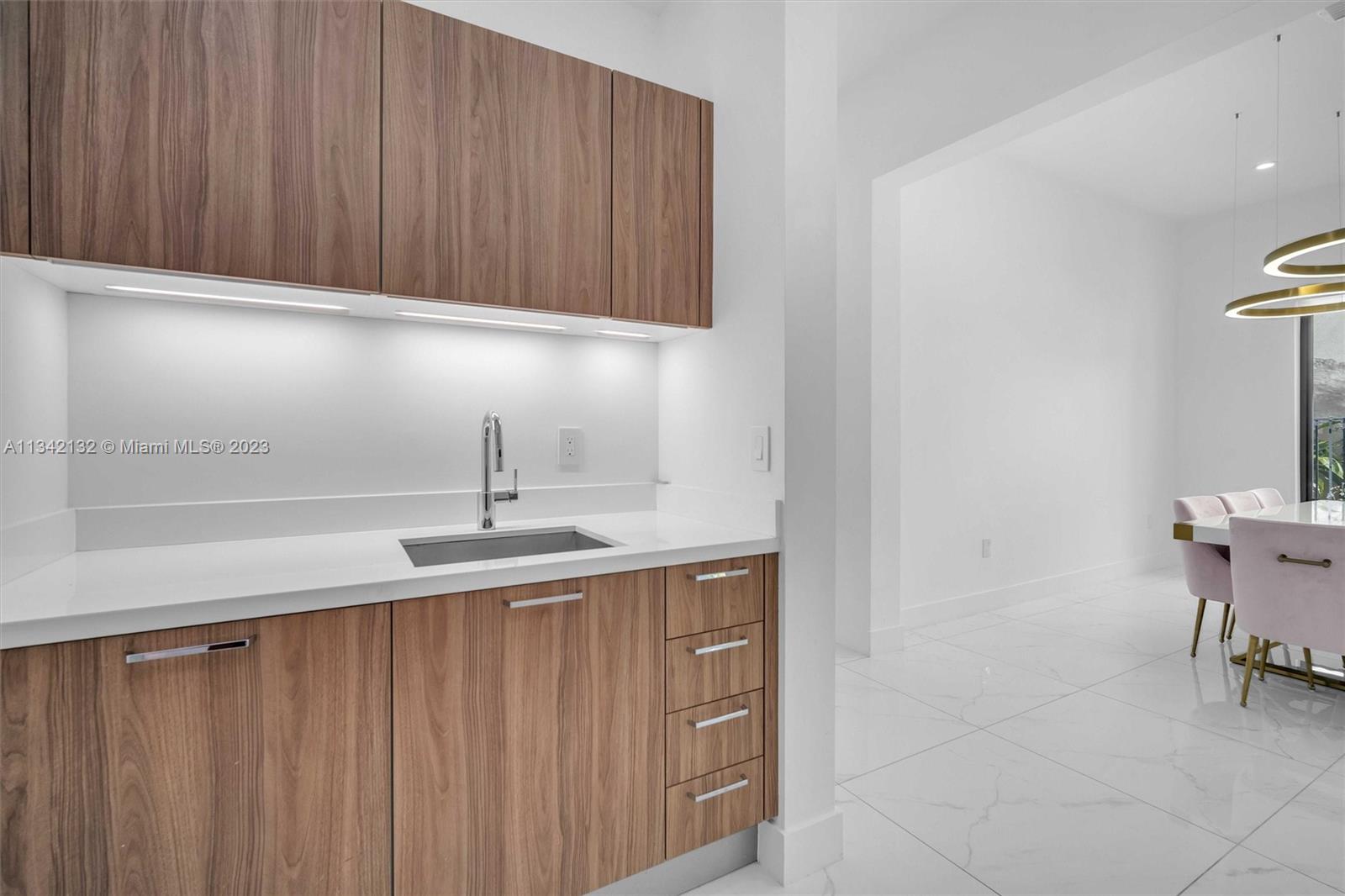 5840 Brookfield Circle Hollywood, FL 33312 - Photo 22 of 45 a kitchen with a sink and cabinets