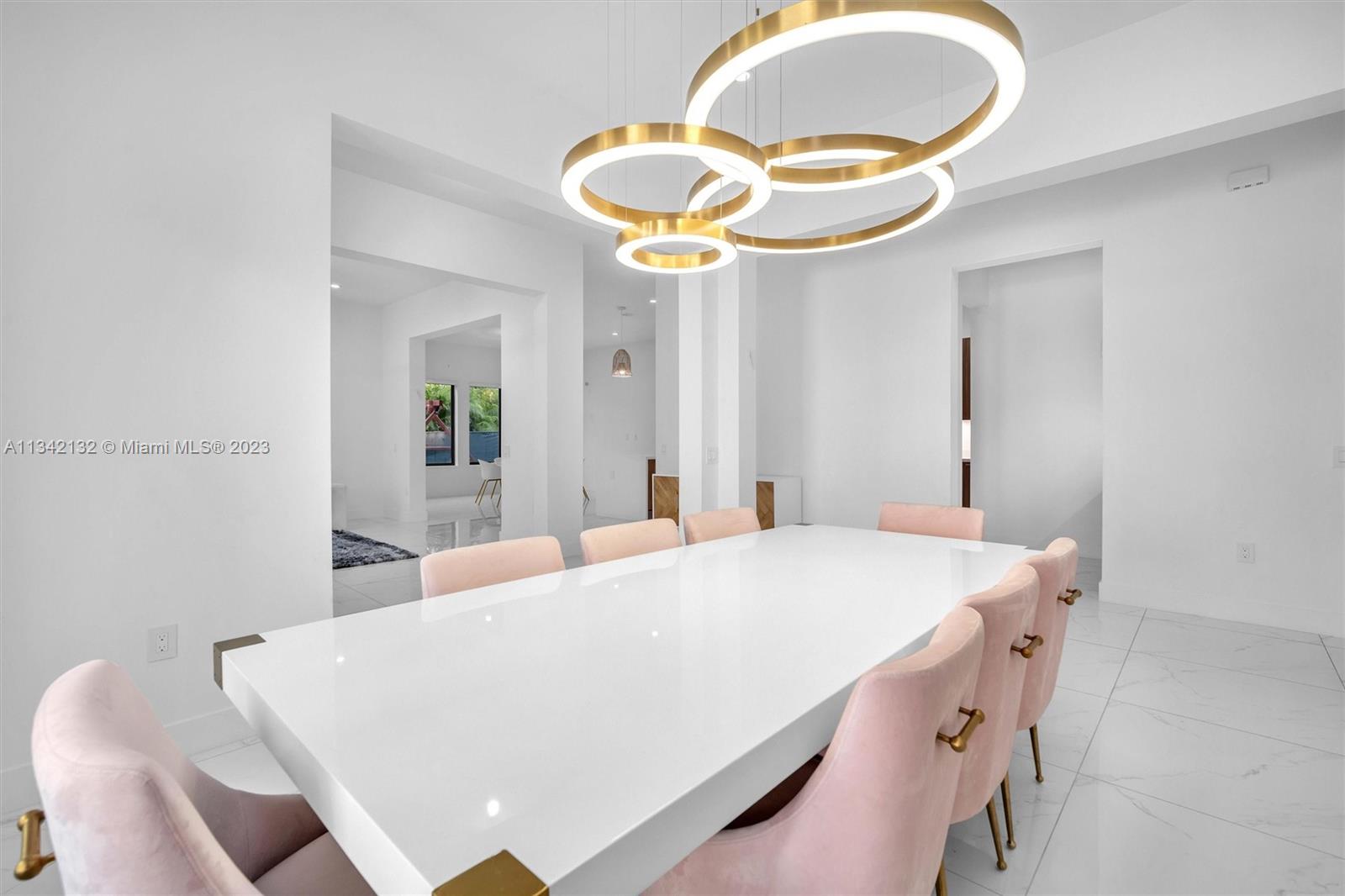 5840 Brookfield Circle Hollywood, FL 33312 - Photo 24 of 45 a bedroom with a bed and a chandelier