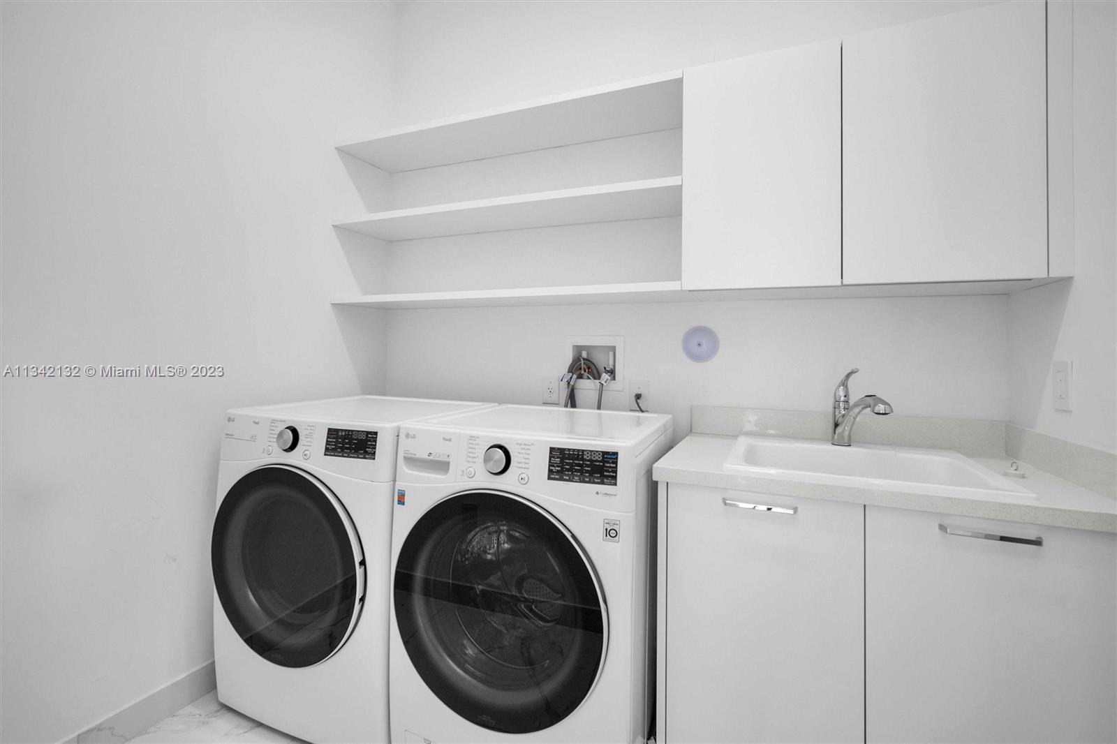 5840 Brookfield Circle Hollywood, FL 33312 - Photo 28 of 45 a utility room with dryer and washer