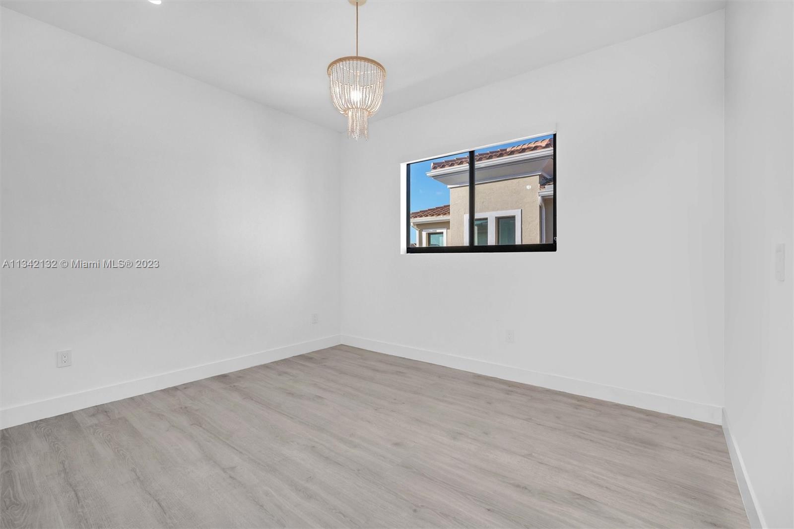 5840 Brookfield Circle Hollywood, FL 33312 - Photo 29 of 45 a view of an empty room with wooden floor