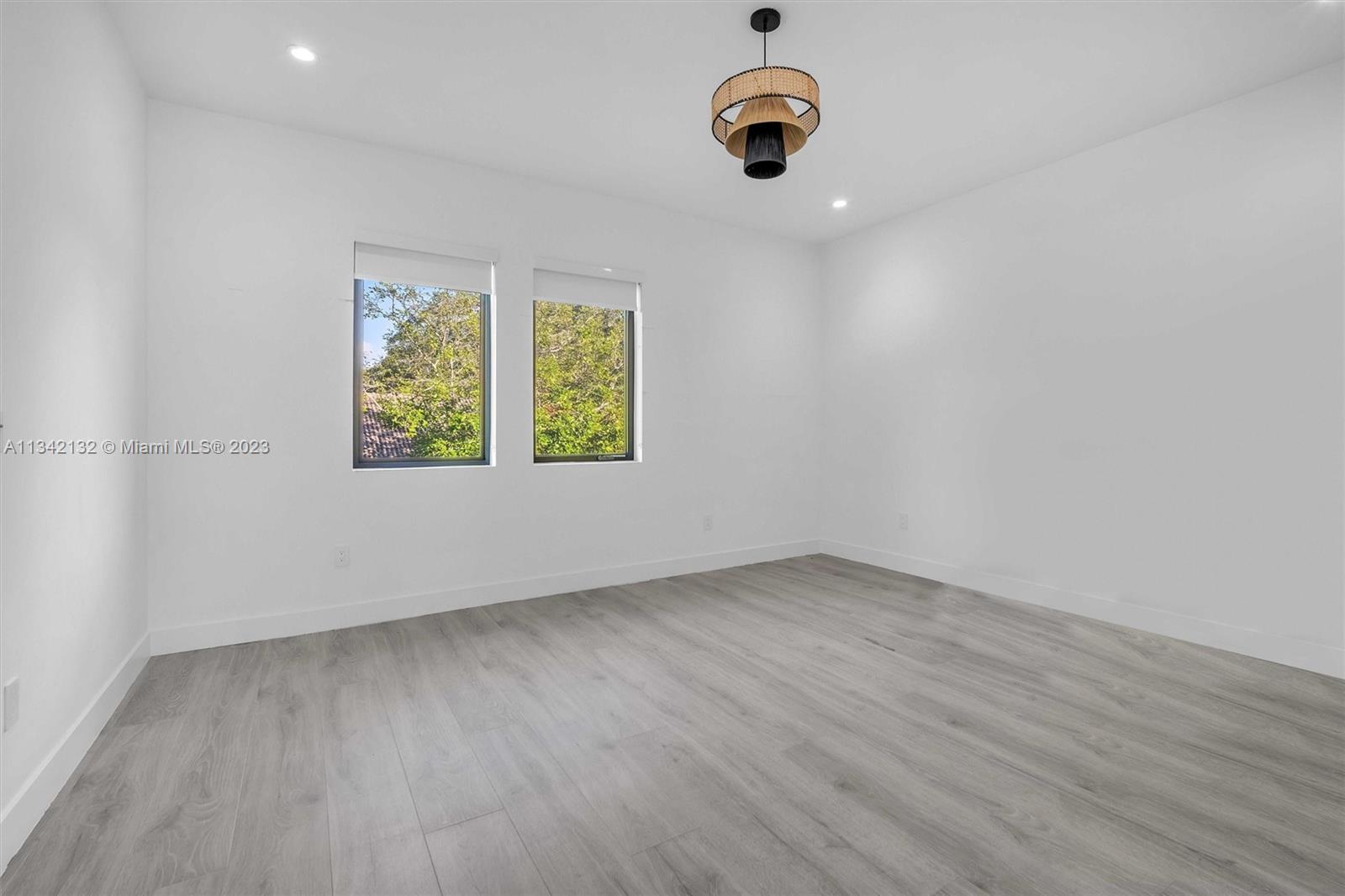 5840 Brookfield Circle Hollywood, FL 33312 - Photo 36 of 45 an empty room with windows and fan