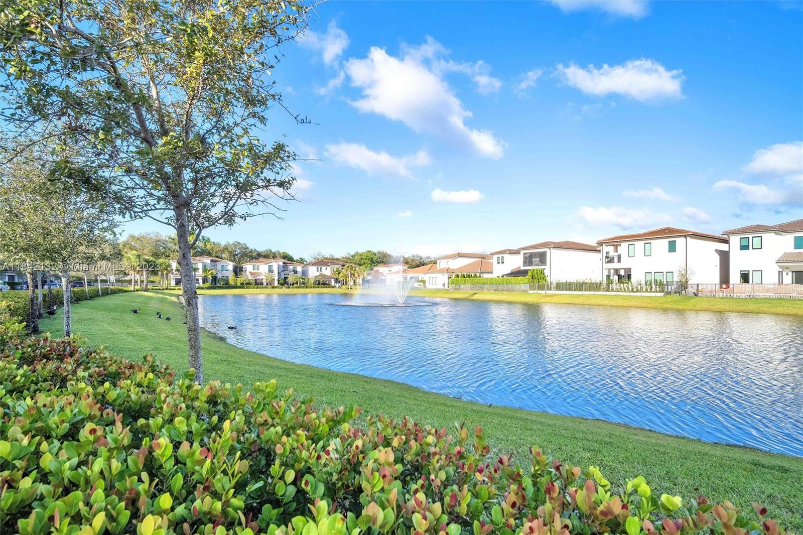 5840 Brookfield Circle Hollywood, FL 33312 - Photo 39 of 45 a view of a lake with houses in the back