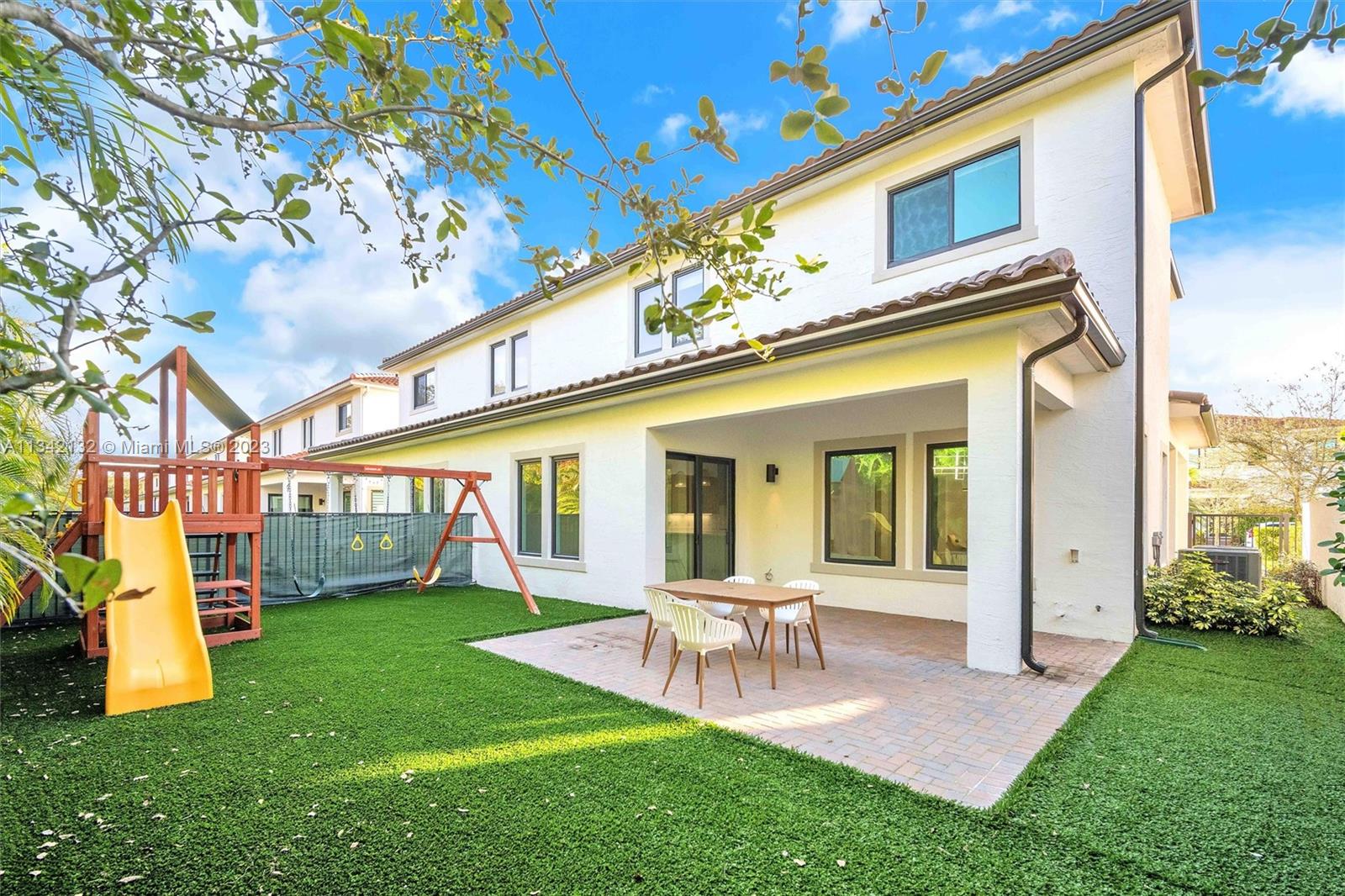 5840 Brookfield Circle Hollywood, FL 33312 - Photo 5 of 45 a view of a house with patio entrance and a yard