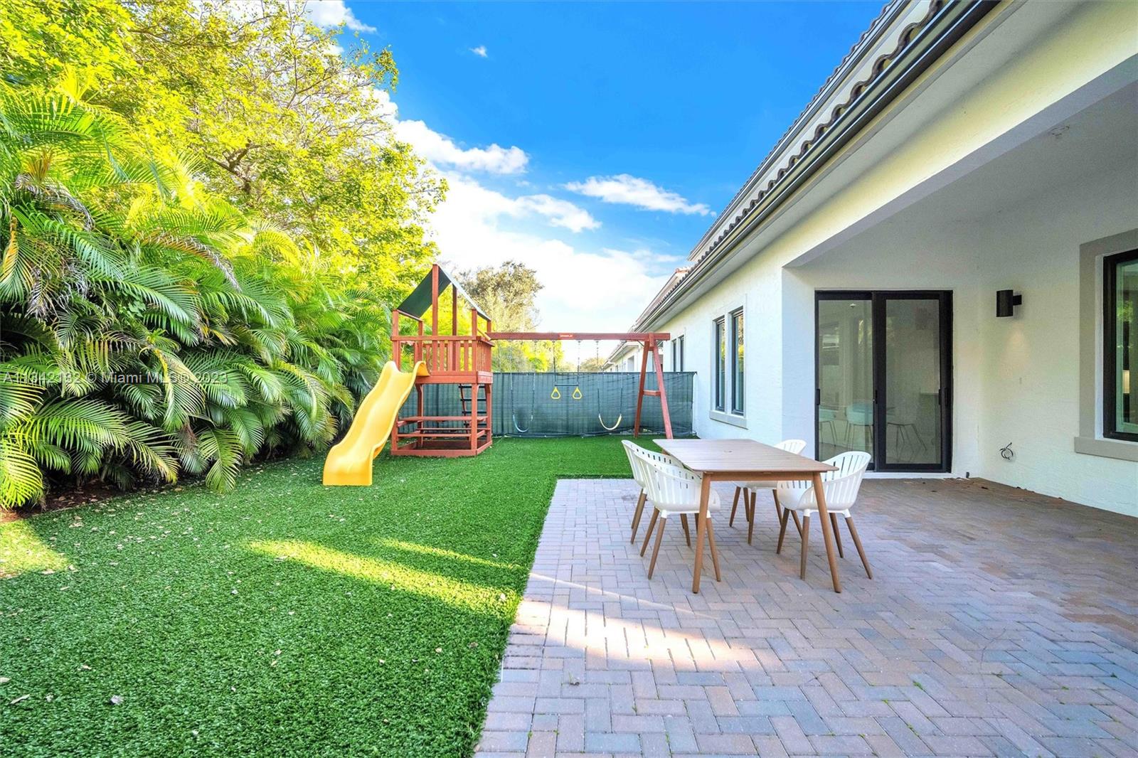 5840 Brookfield Circle Hollywood, FL 33312 - Photo 8 of 45 a view of a house with backyard and a patio