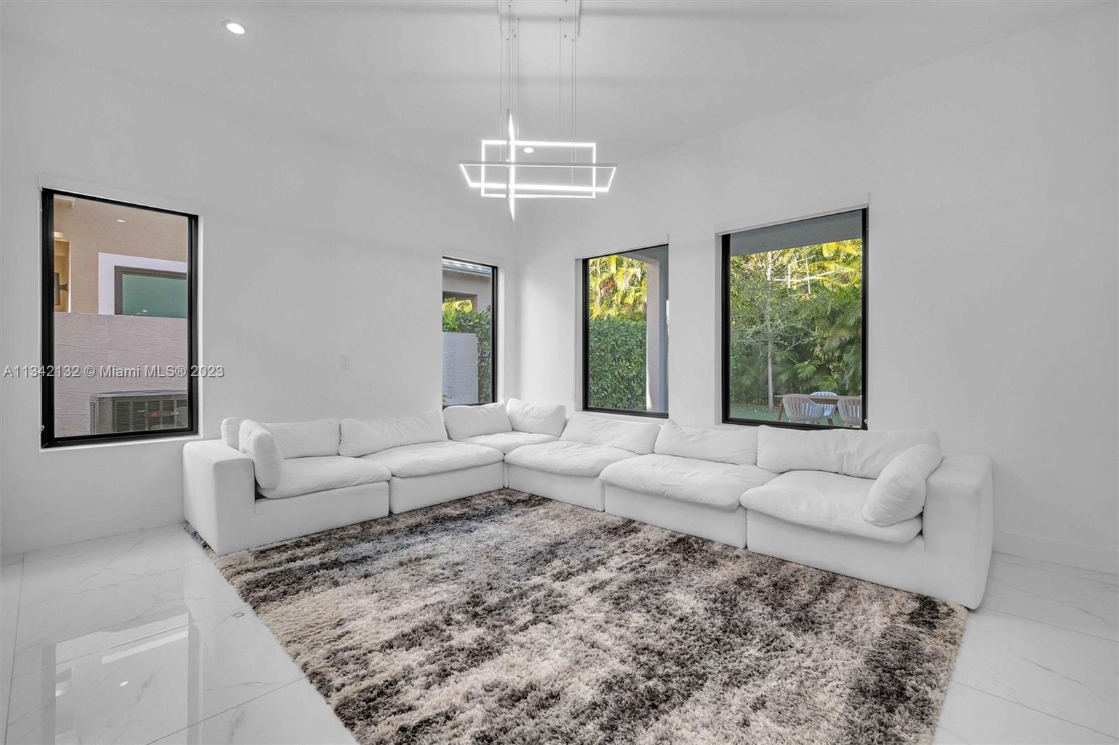 5840 Brookfield Circle Hollywood, FL 33312 - Photo 9 of 45 a living room with furniture and a large window