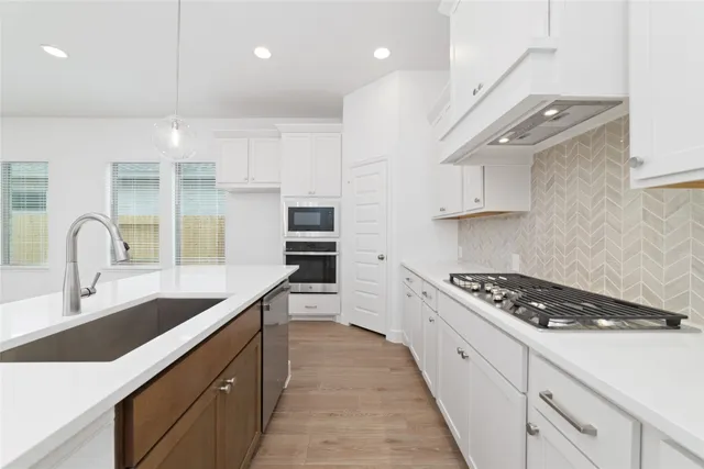 a view of kitchen and empty room