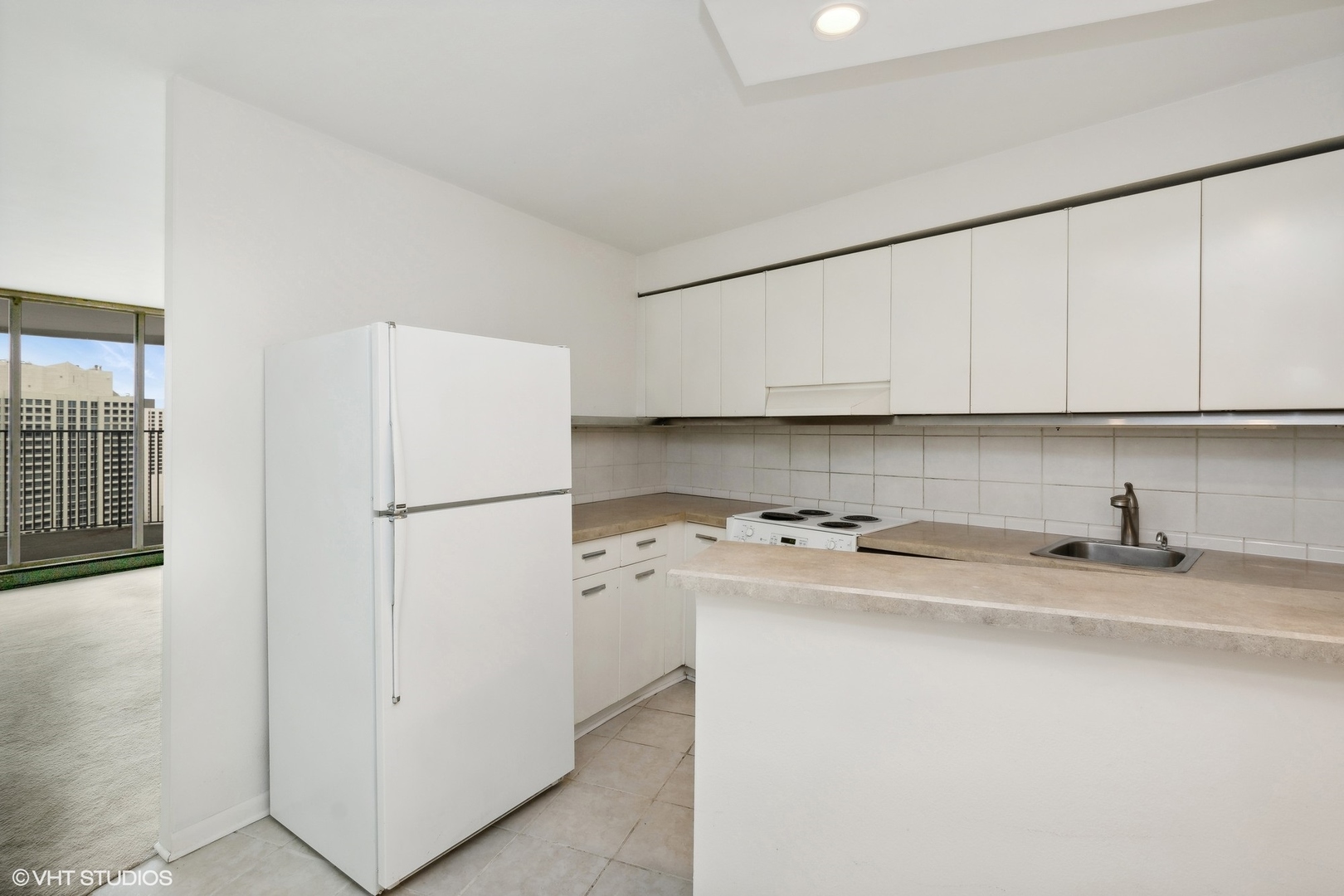 300 North State Street, Unit 4606 Chicago, IL 60654 - Photo 5 of 15 a kitchen with stainless steel appliances a refrigerator sink and cabinets