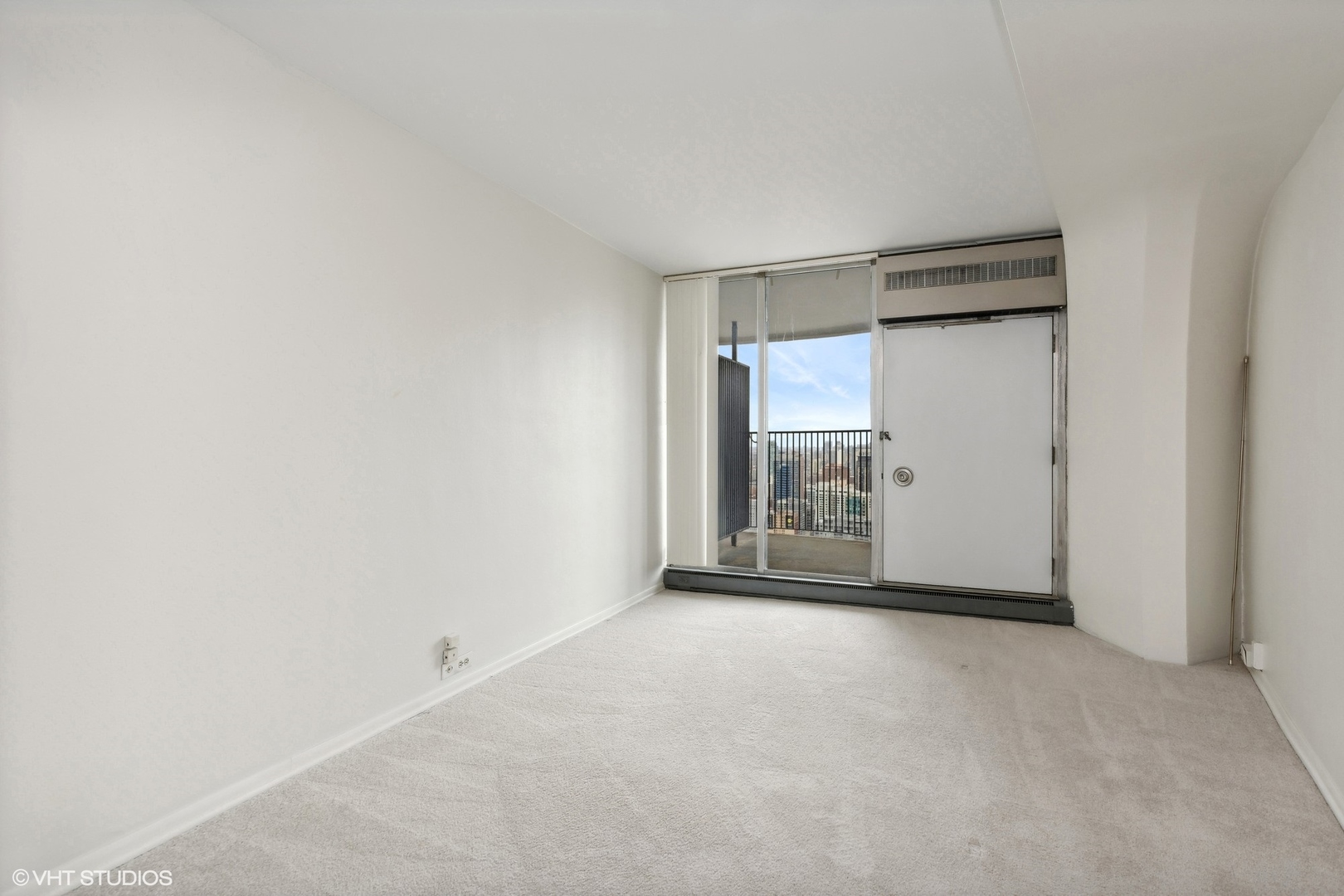 300 North State Street, Unit 4606 Chicago, IL 60654 - Photo 7 of 15 a view of an empty room with a fireplace