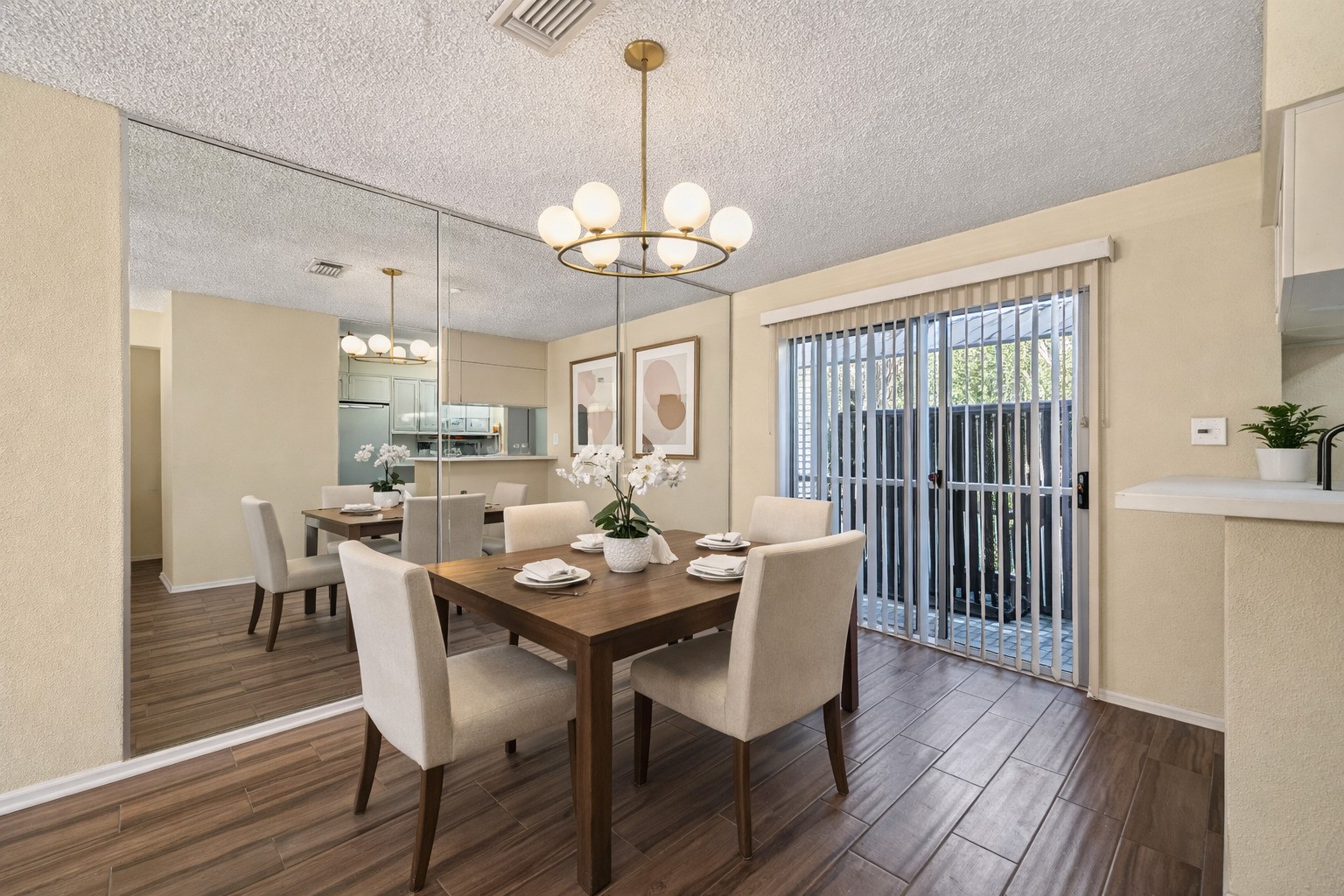 3100 Jeanetta Street, Unit 1004 Houston, TX 77063 - Photo 13 of 42 A virtually staged look at the dining area shows how the mirrored wall and glass sliders work together to double the sense of space and light. (Virtually staged)