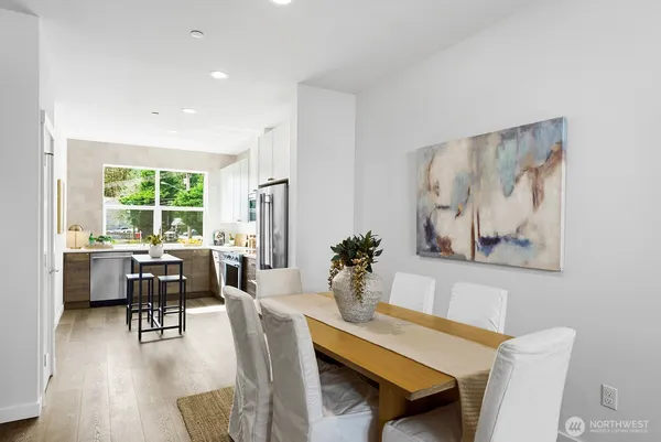 a view of a dining room with furniture window and wooden floor