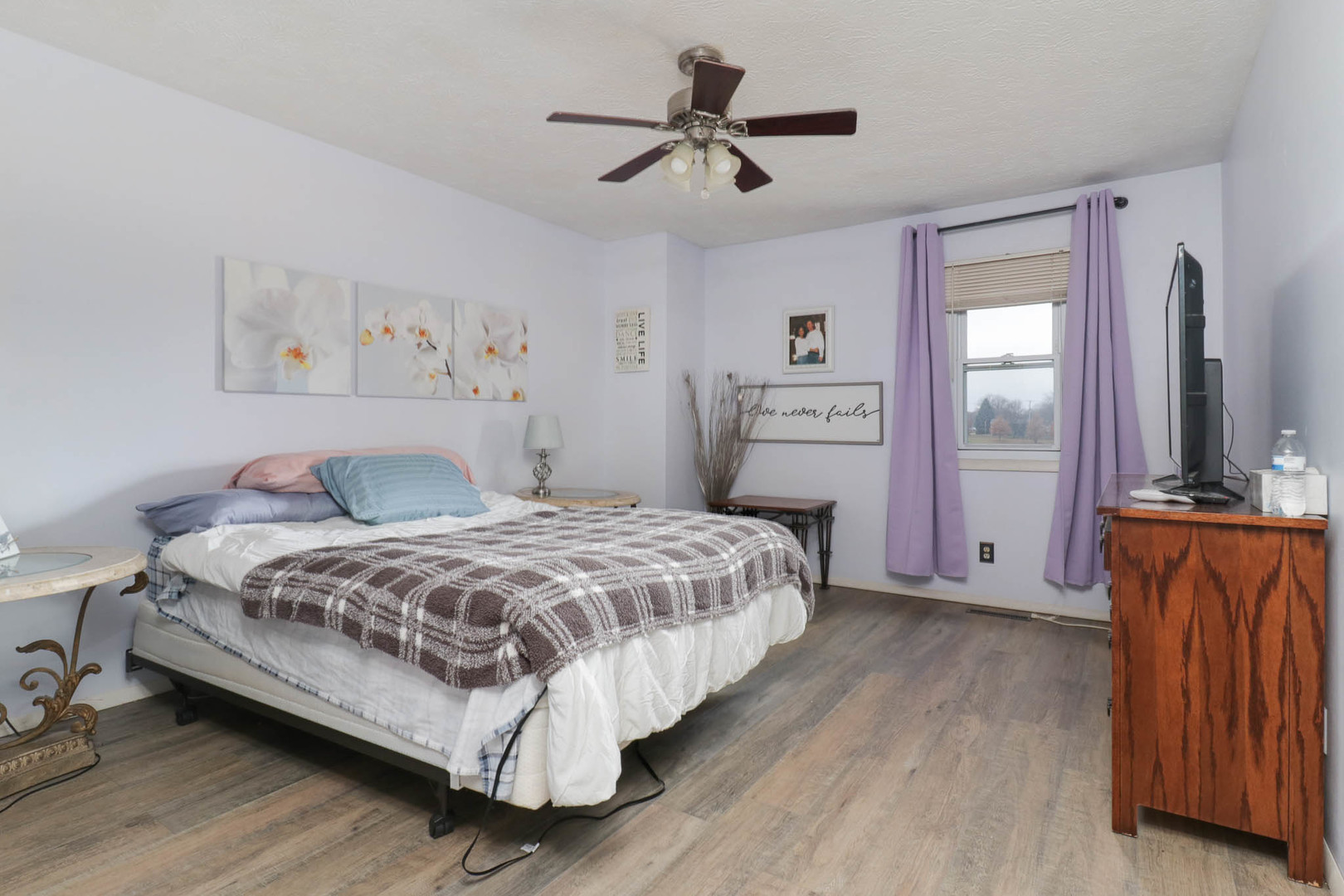 1550 Hunt Drive, Unit C Normal, IL 61761 - Photo 14 of 21 a bedroom with a bed and a chandelier