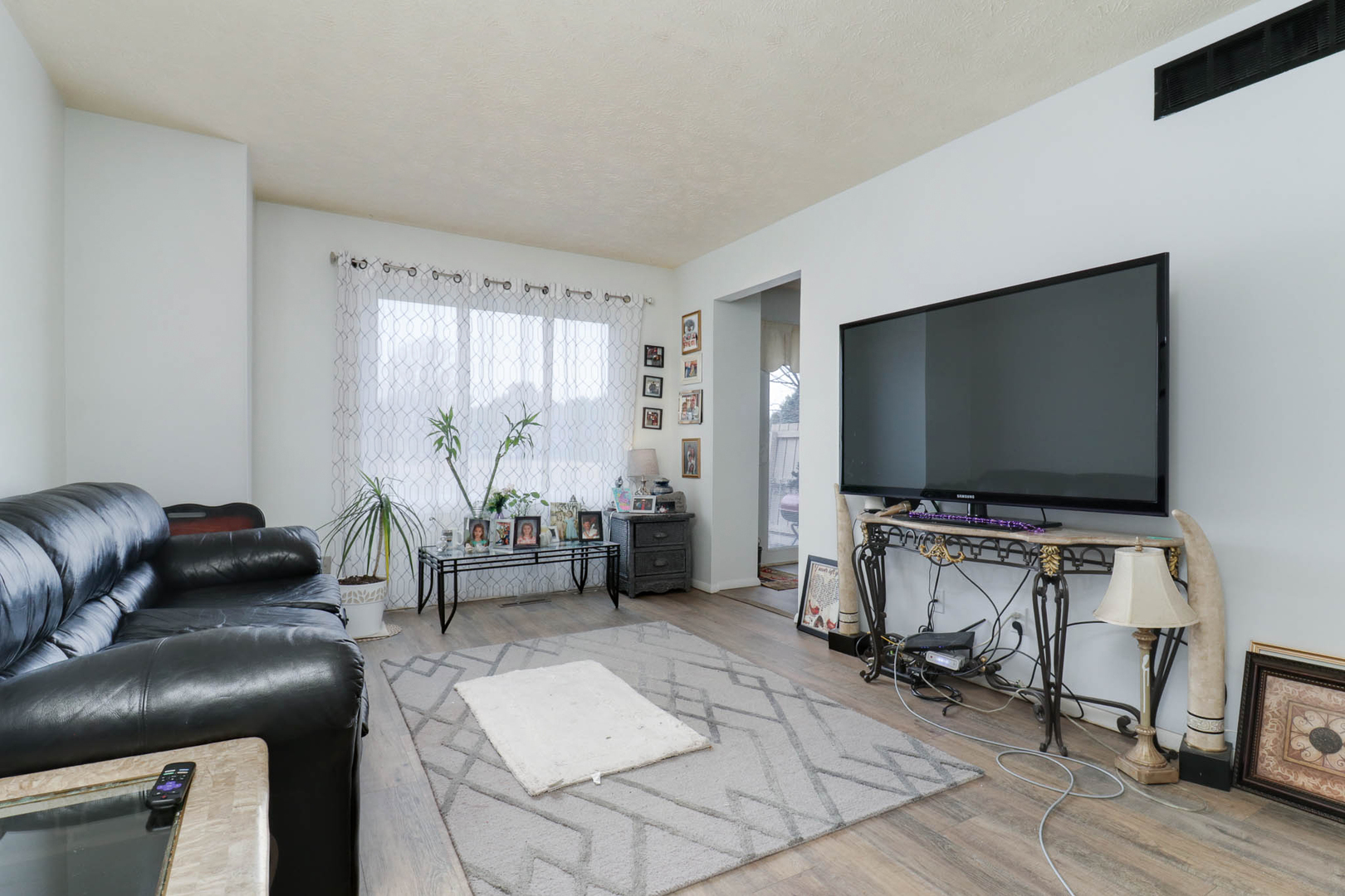 1550 Hunt Drive, Unit C Normal, IL 61761 - Photo 3 of 21 a living room with furniture and a flat screen tv