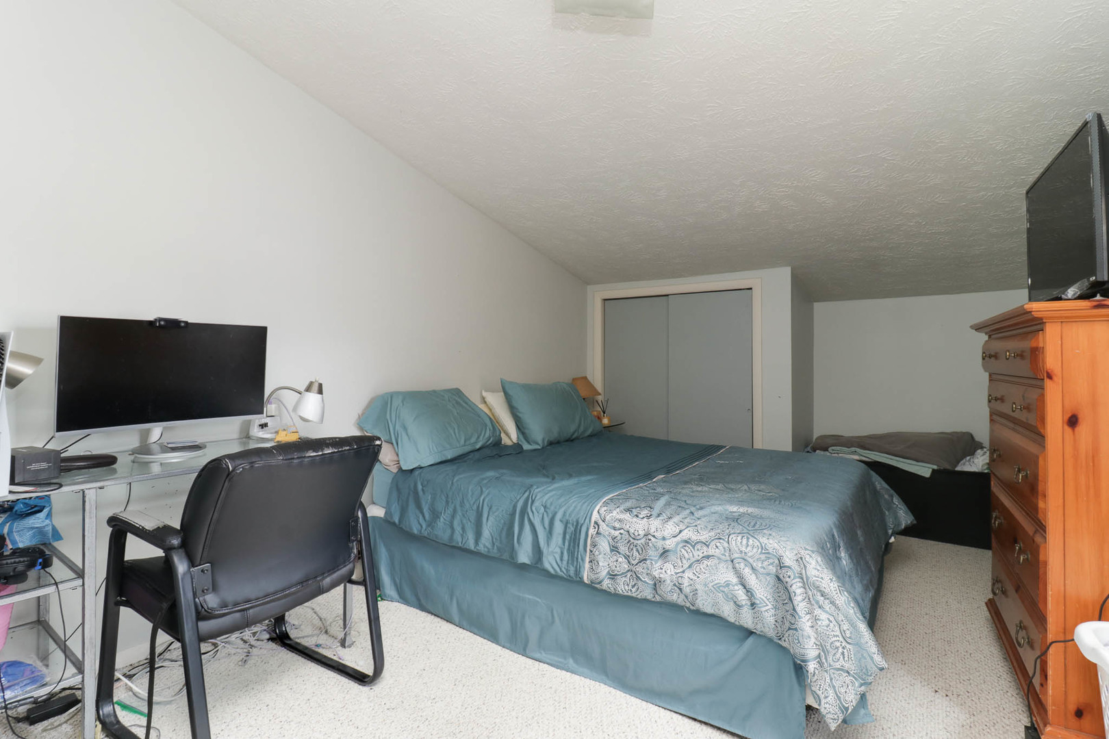1550 Hunt Drive, Unit C Normal, IL 61761 - Photo 9 of 21 a bedroom with a bed and a flat screen tv