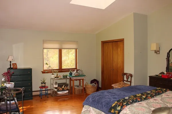 a bedroom with a bed and furniture
