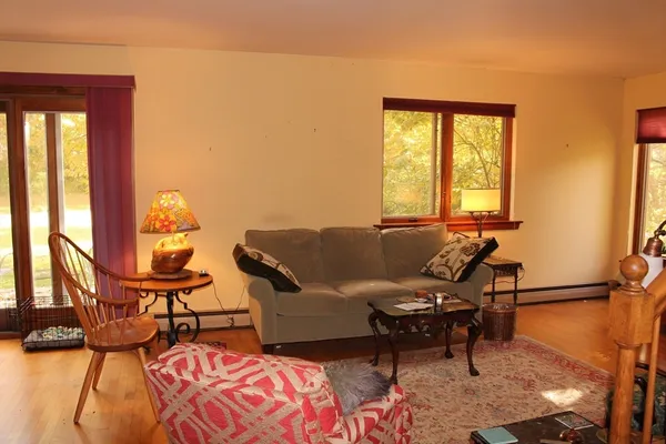 a living room with furniture and a window