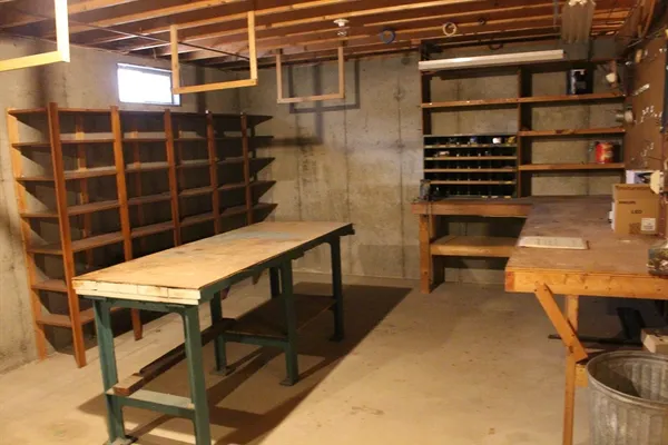 a balcony with table and chairs