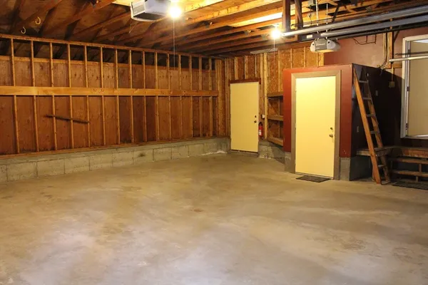 a view of a room with wooden walls