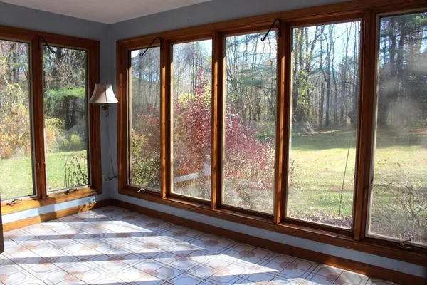 a view of a room that has a large window and a floor to ceiling window