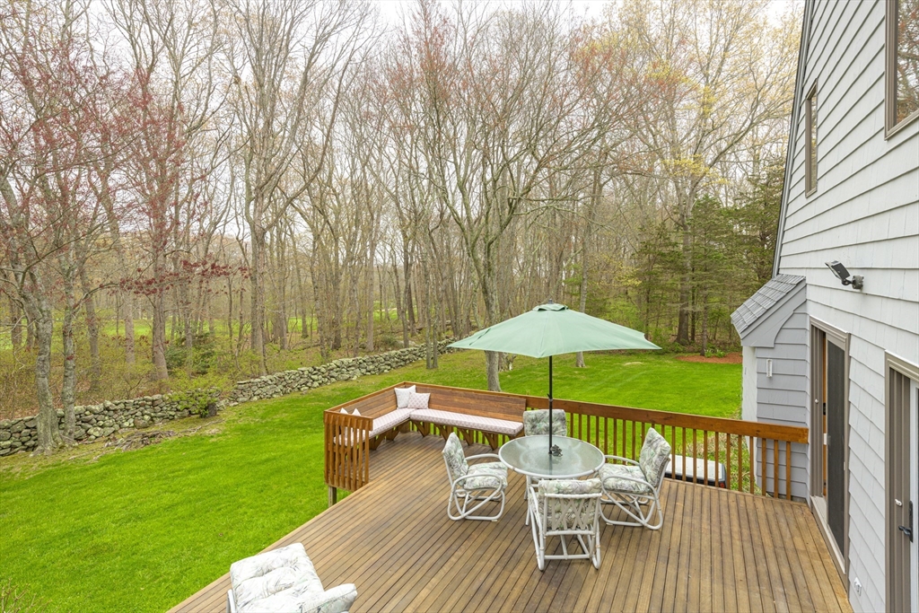 94 Howland Road Westport, MA 02790 - Photo 8 of 33 a view of a table and chairs on the deck