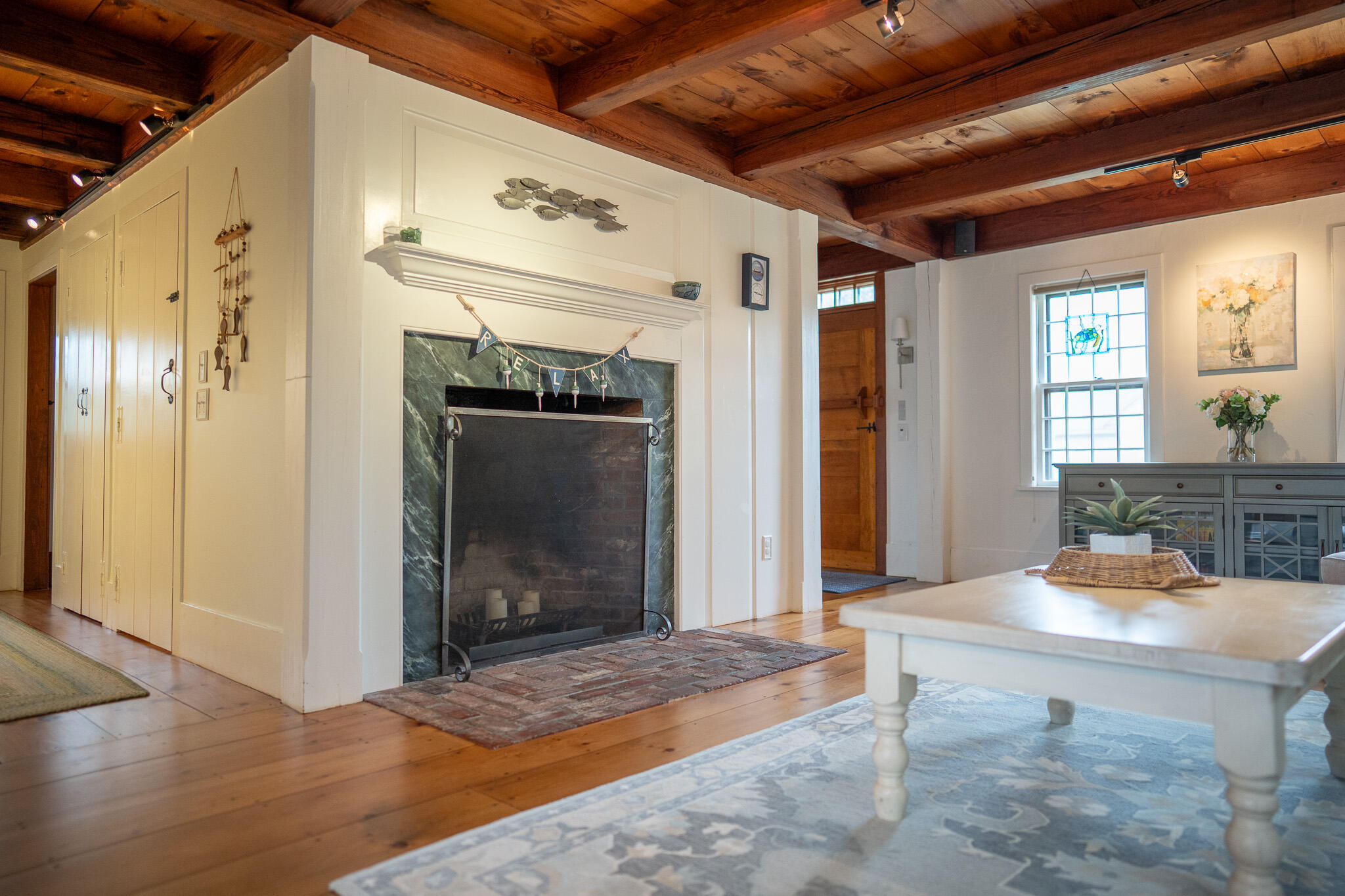 625 Bridge Road Eastham, MA 02642 - Photo 12 of 104 a view of a hallway with wooden floor and dining room