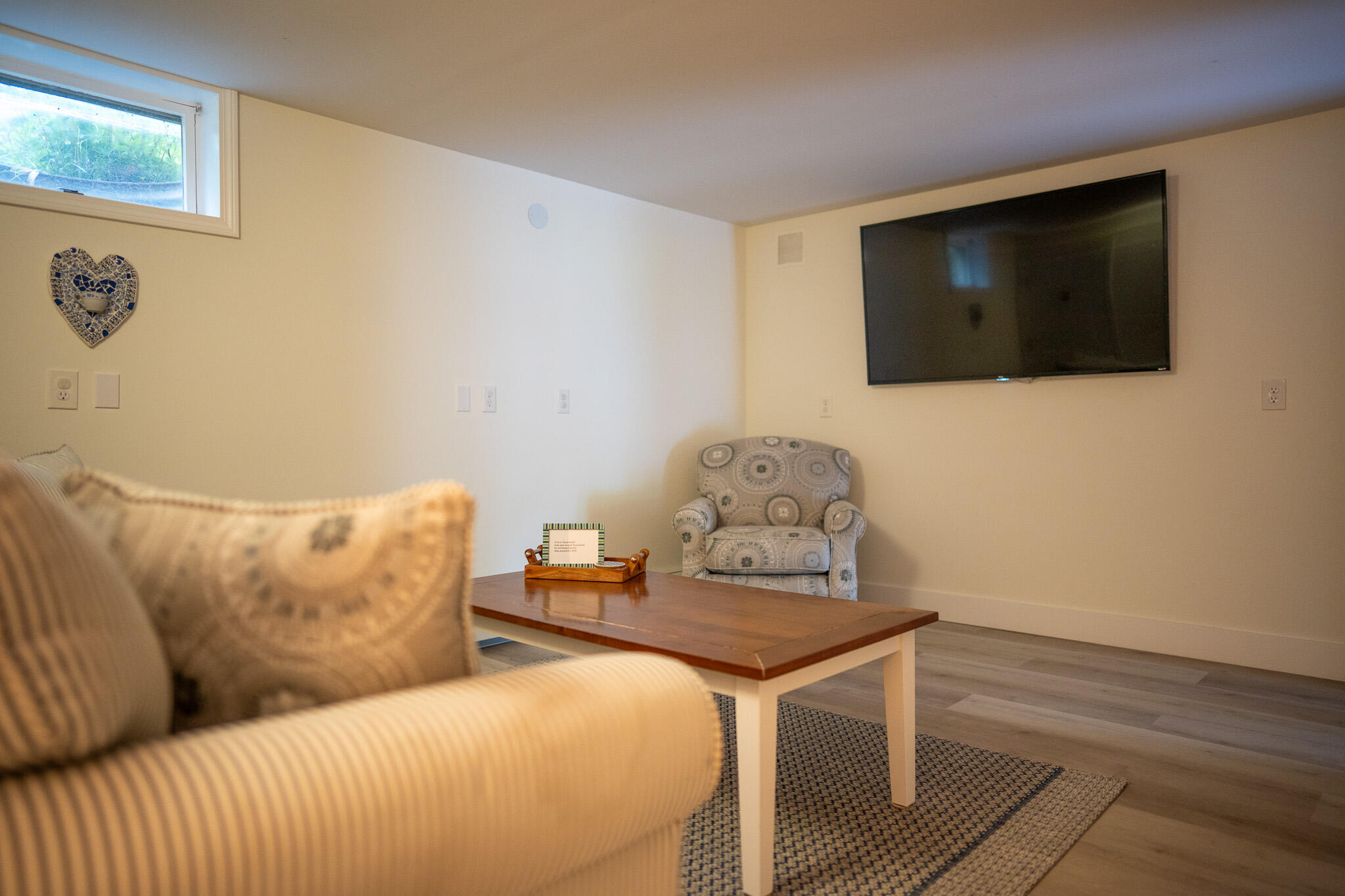 625 Bridge Road Eastham, MA 02642 - Photo 55 of 104 a living room with furniture and a flat screen tv