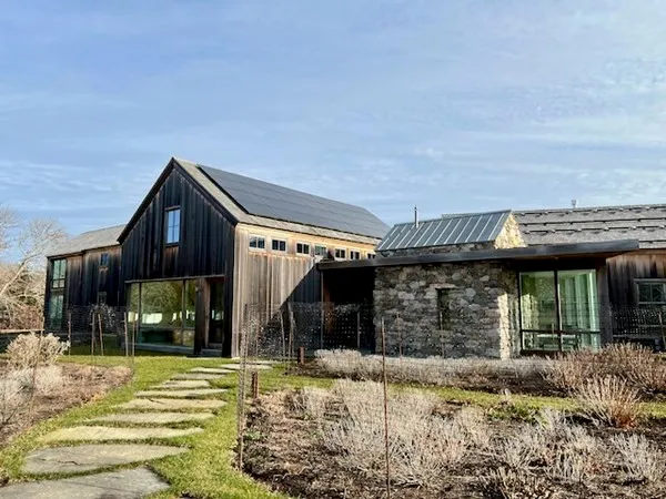 a front view of a house with garden