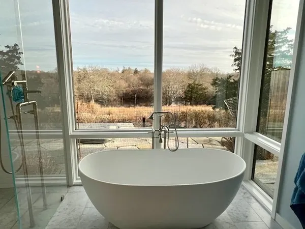 a view of a living room with a floor to ceiling window