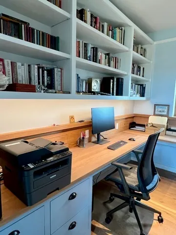 a view of a workspace with furniture
