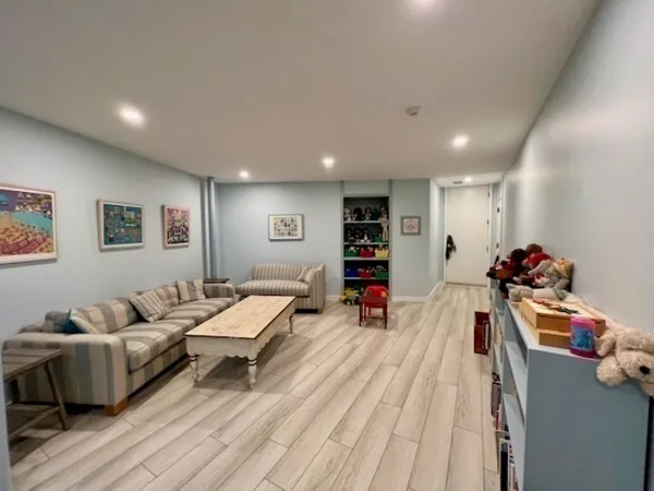 a room with furniture and a wooden floor